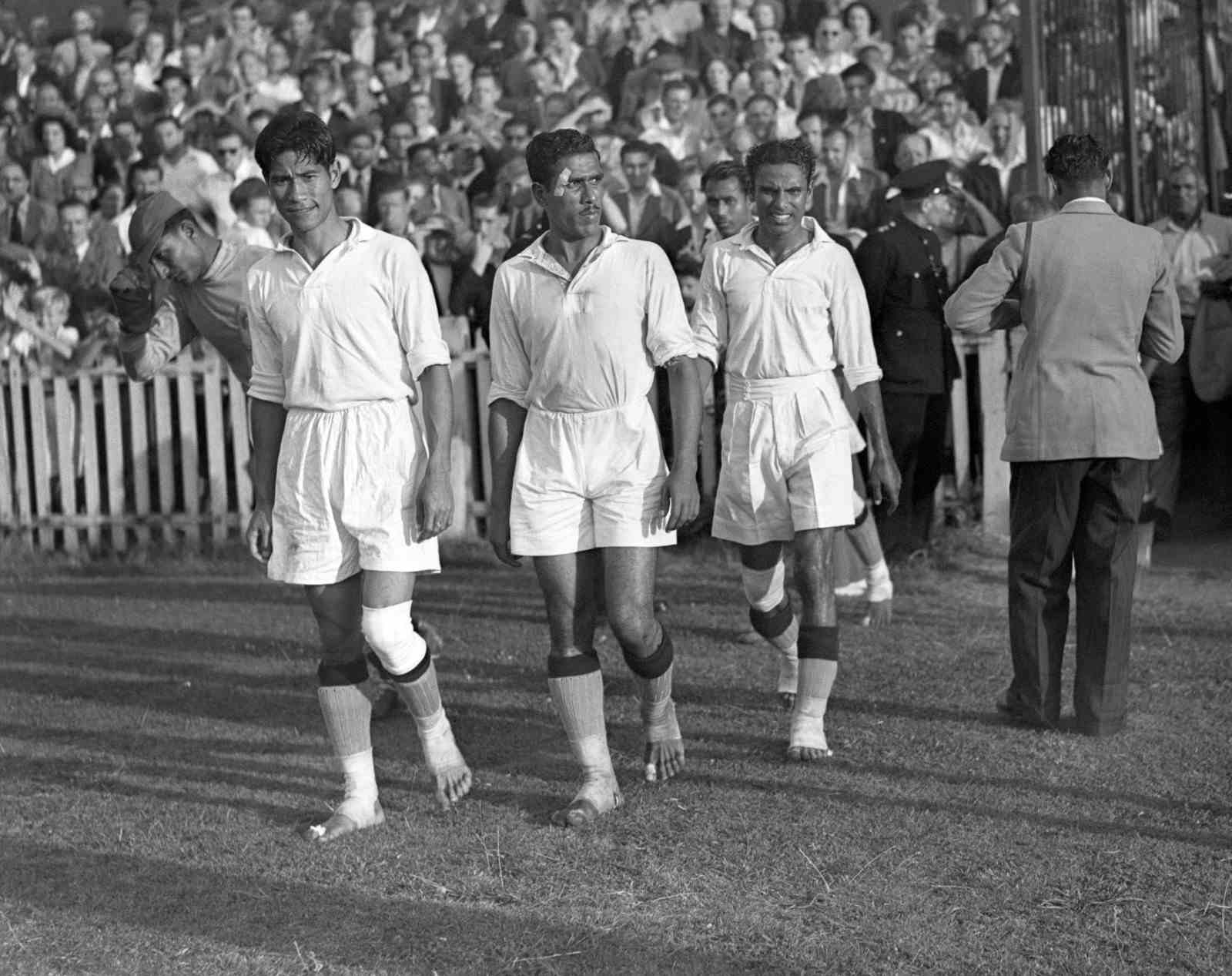 Bare-footed India players walk out at Ilford for their match against France (Photo by Barratts/PA Images via Getty Images)
