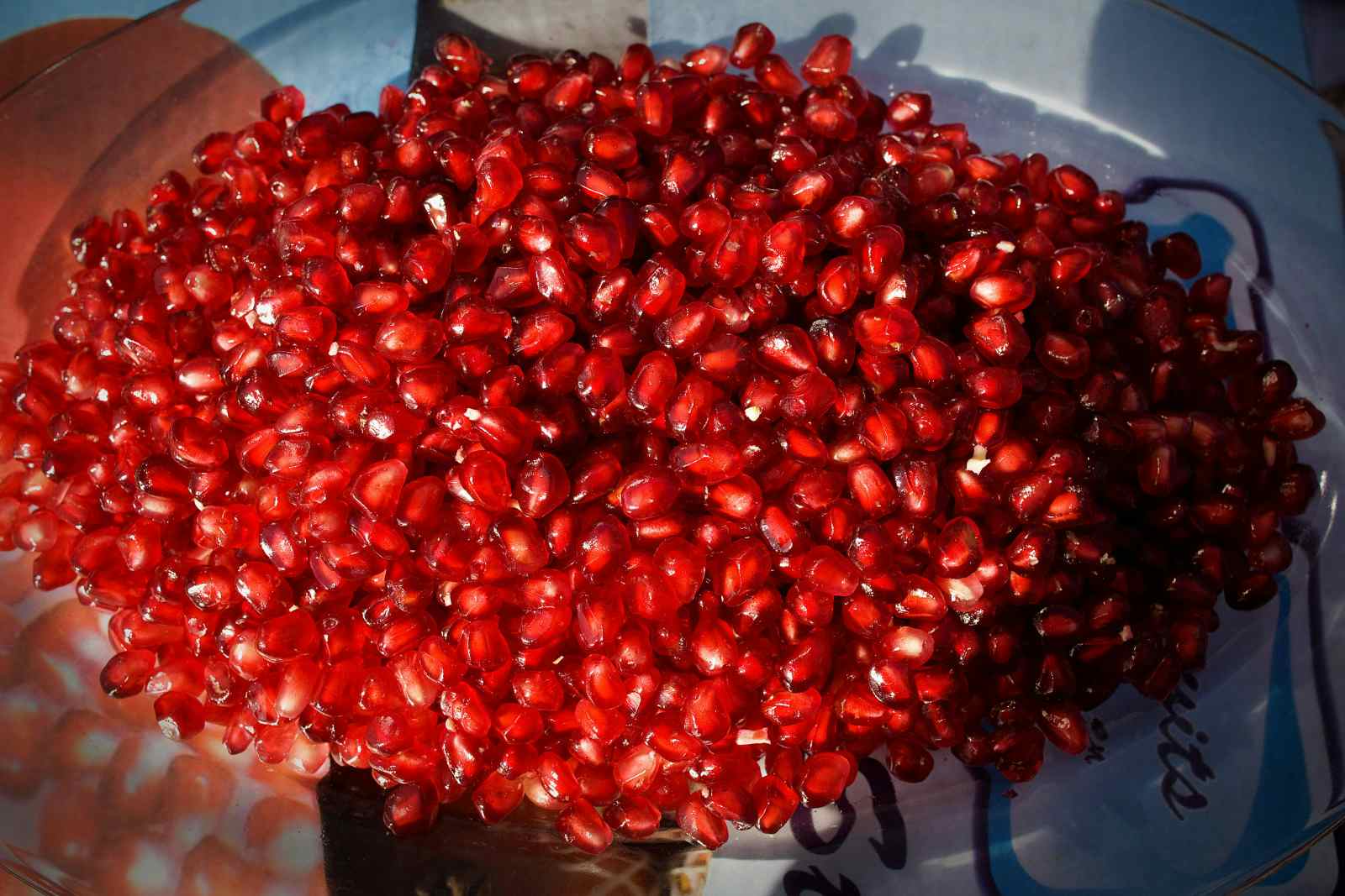 OCTOBER 15, 2009: Pomegranates seeds are displayed at the Omaid Bahar Fruit Processing Company in Kabul, Afghanistan. The new $11 million factory has contracts for juice concentrate and whole fruits with major buyers in India, the Gulf, Europe, and America (Paula Bronstein/Getty Images)