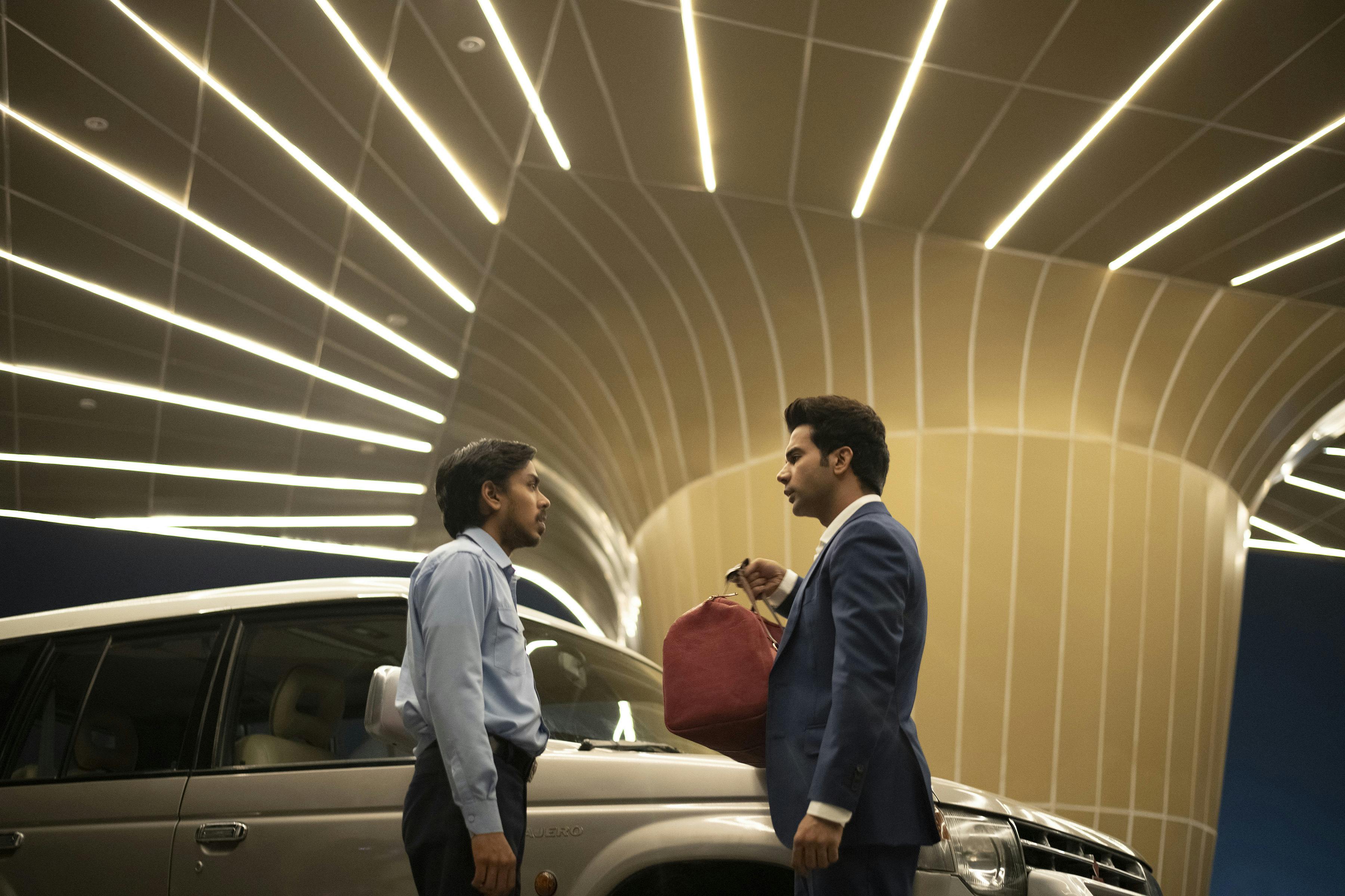 Adarsh Gourav and Rajkummar Rao in 'The White Tiger' (Netflix).