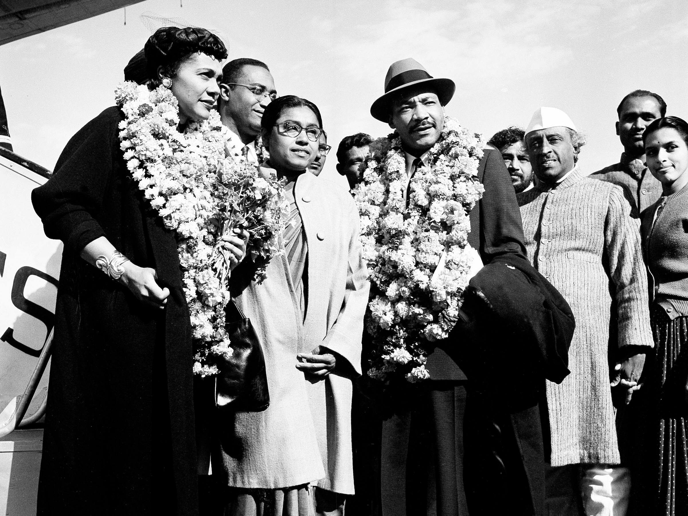 Rev. Dr. Martin Luther King, Jr. and his wife Coretta, received by admirers after landing in Delhi, India, Feb. 10, 1959. King, known in the U.S. as the American Gandhi, flew to India on what he calls a "four-week pilgrimage in India which to me means Mahatma Gandhi." (AP Photo/Rangaswamy Satakopan)