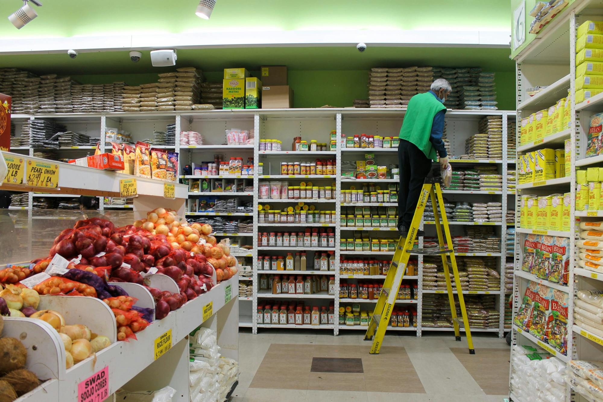 Patel Brothers employee stocking shelves (Trisha Gopal)