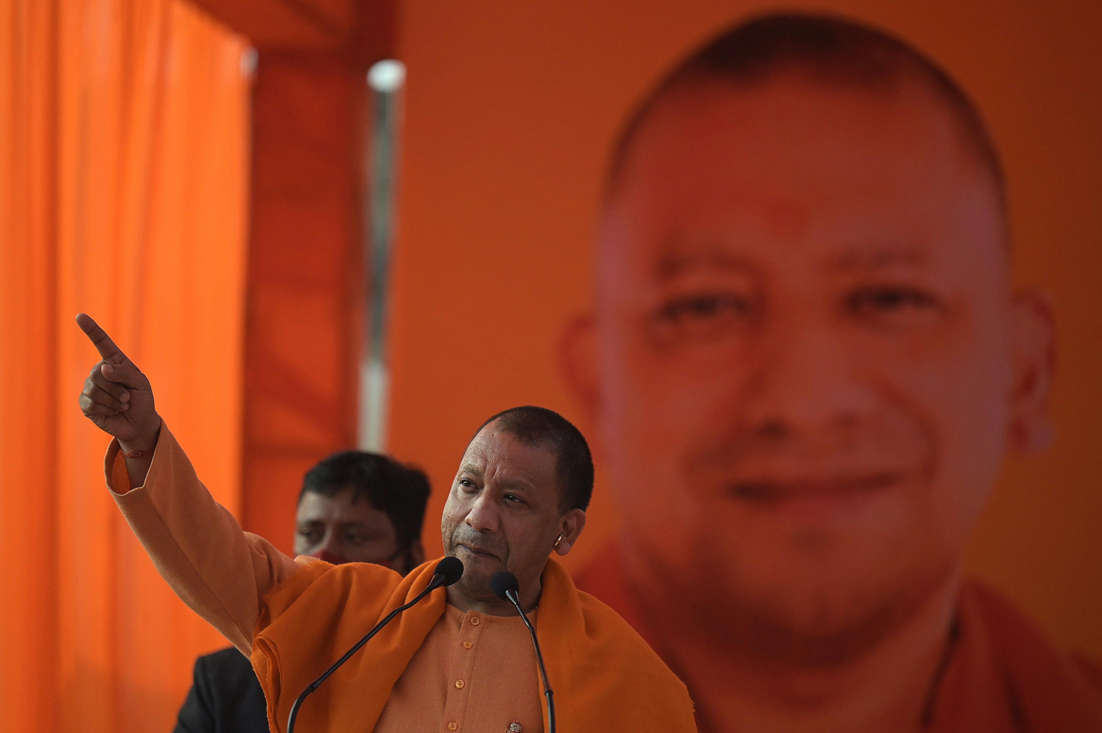 Chief Minister of Uttar Pradesh Yogi Adityanath gestures as he speaks during an election campaign rally in Modinagar in Ghaziabad district, some 45km east of New Delhi, on February 1, 2022. (MONEY SHARMA/AFP via Getty Images)