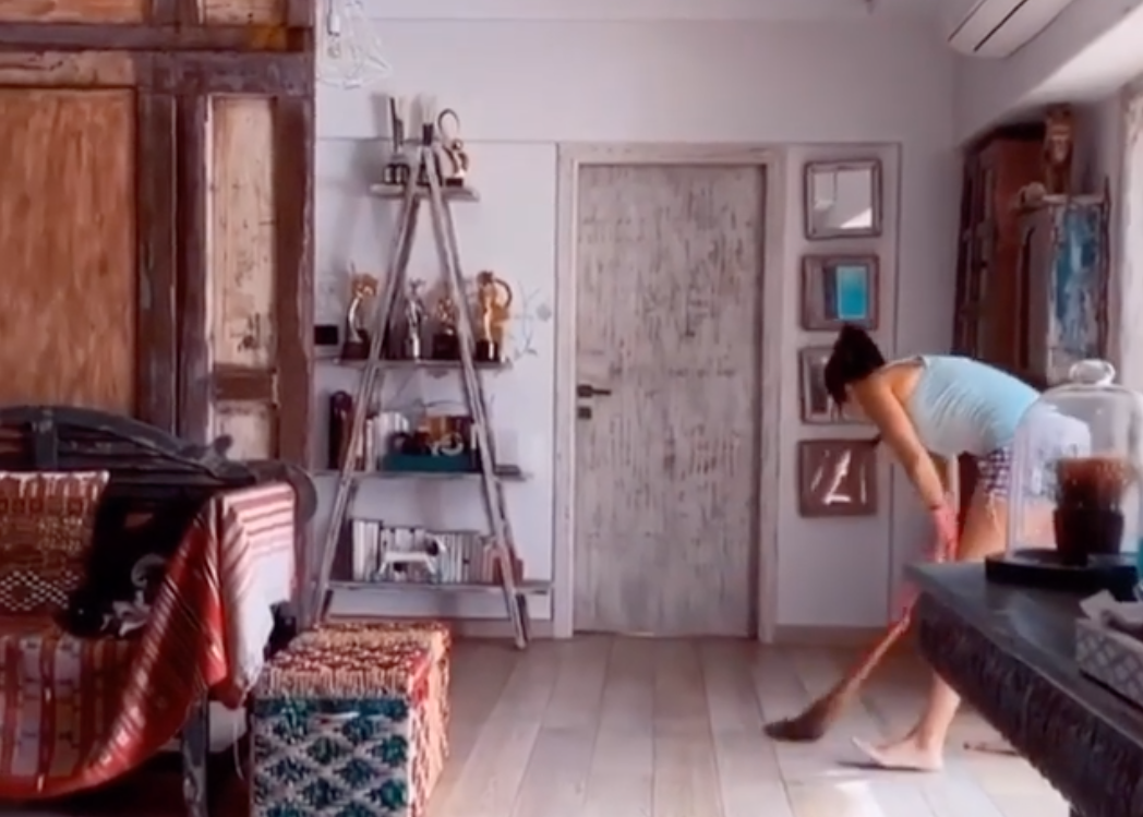 Members of Katrina Kaif household using a jharu to clean up their apartment during the national lockdown (Katrina Kaif Instagram)