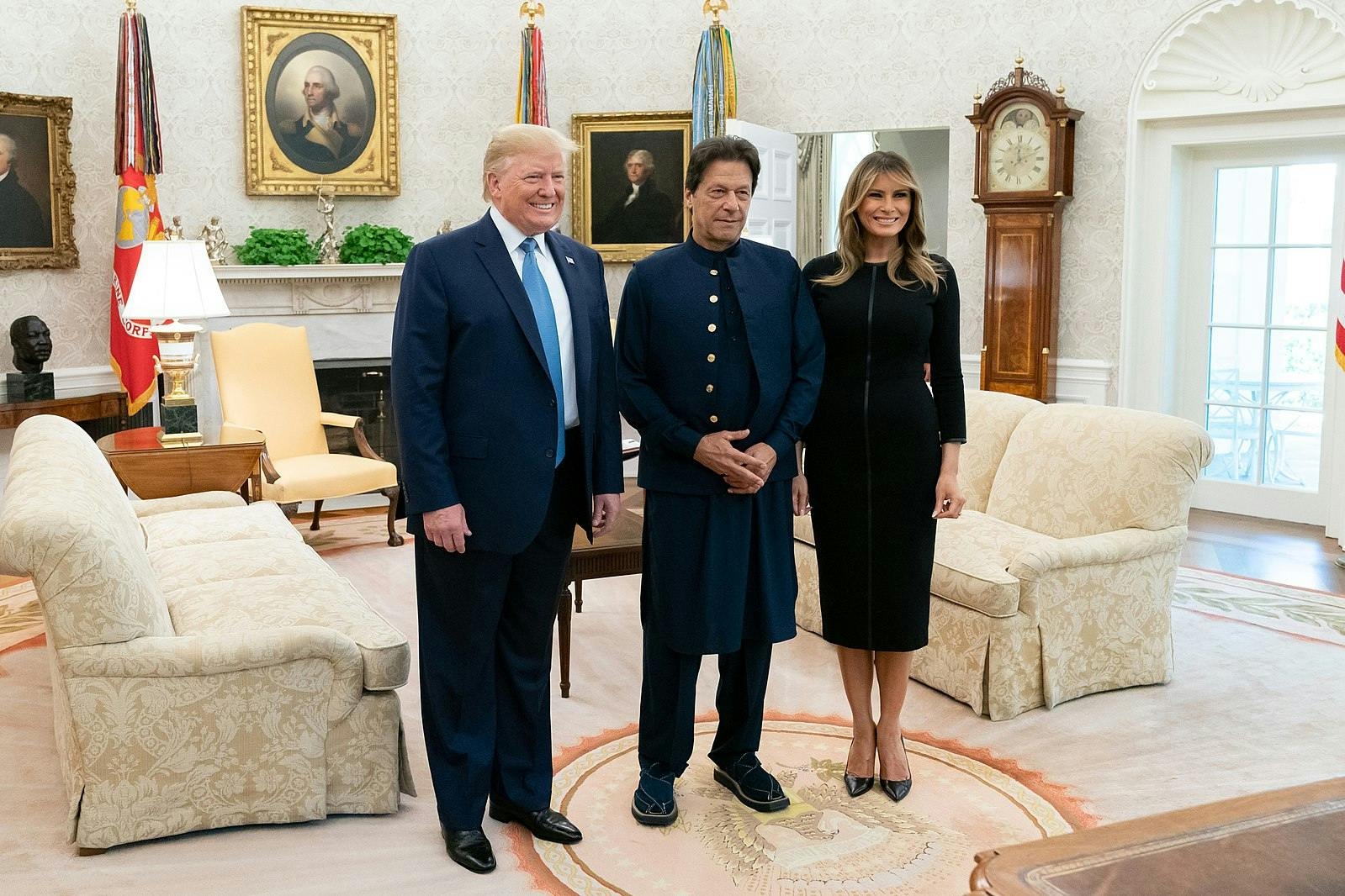 Donald J. Trump and Melania Trump pose for a photo with the Prime Minister of the Islamic Republic of Pakistan Imran Khan Monday, July 22, 2019, in the Oval Office of the White House. (Official White House Photo by Andrea Hanks, via Wikimedia Commons)
