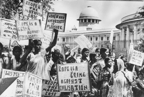 March 25, 1980: Members of the National Federation of Indian Women demonstrating outside the Supreme Court, New Delhi as they demand the re-opening of the 'Mathura rape case'. (Photo by Keystone / Getty Images)